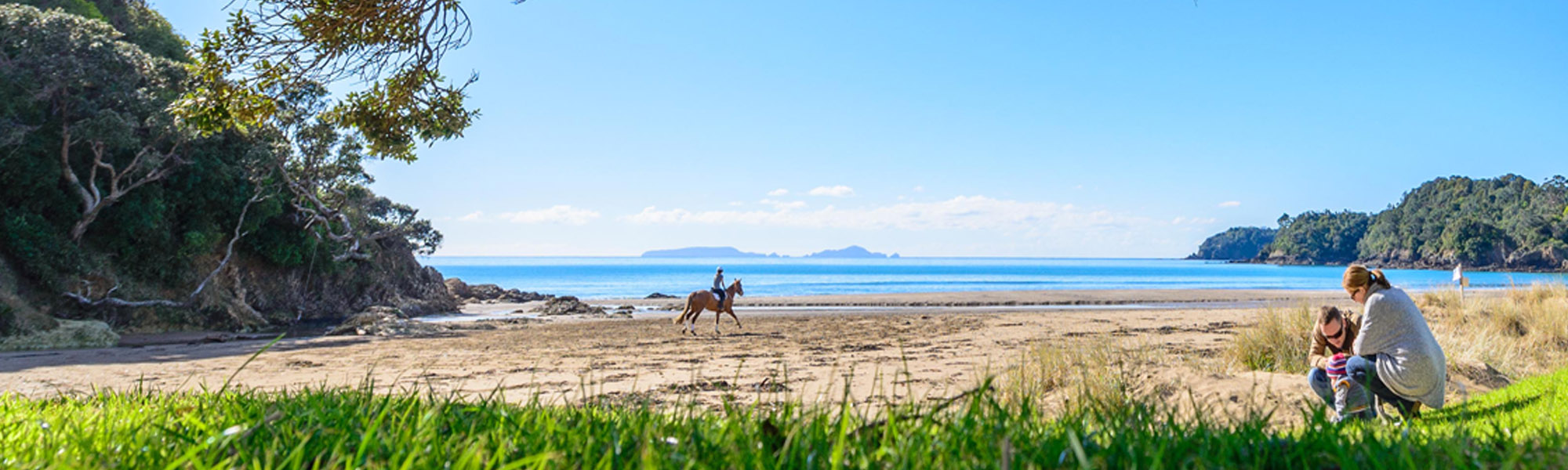 People enjoying Sandy Bay